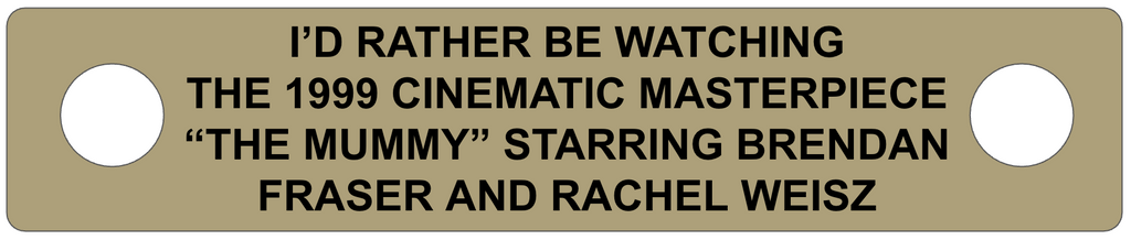 Metallic plaque with text about watching 'The Mummy' movie starring Brendan Fraser and Rachel Weisz.